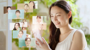 Woman smiling at a smartphone with floating, mosaic-style photo thumbnails around her