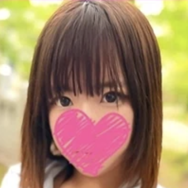 Close-up of a person with straight brown hair outdoors, a pink heart sticker covering the mouth.